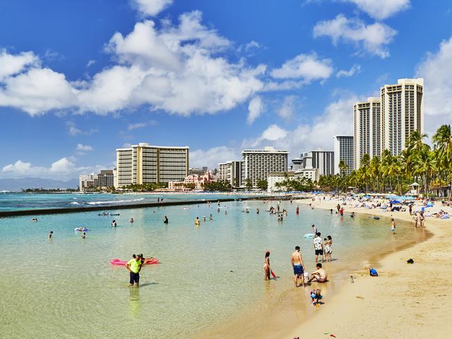 Waikiki, Oahu, Hawaii, USA, - February 6, 2023: Tourists on Waikiki Beach.Escape 25 February 202472hrs WaikikiPhoto - iStock