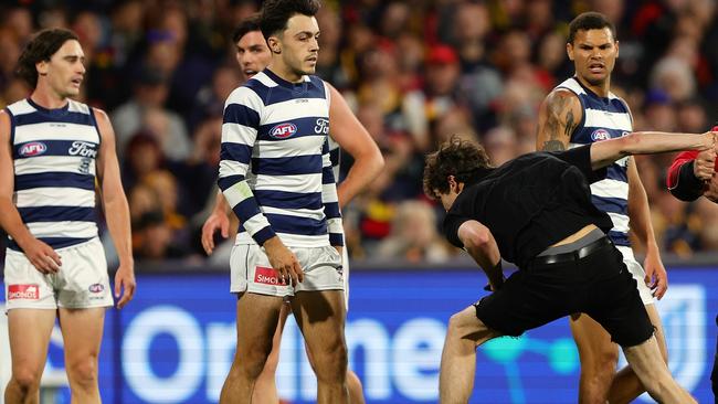 The man came into contact with at least two players. Picture: Sarah Reed/AFL Photos via Getty Images