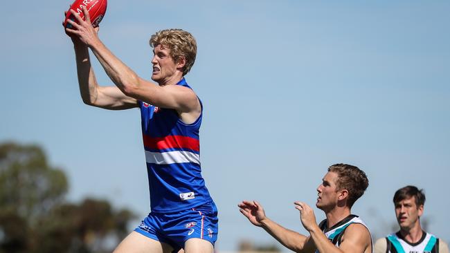 Tim English leaps for a mark against Port Adelaide during the Marsh Series. Picture: Getty Images