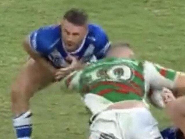Josh Reynolds winces in pain after tackling Tom Burgess.