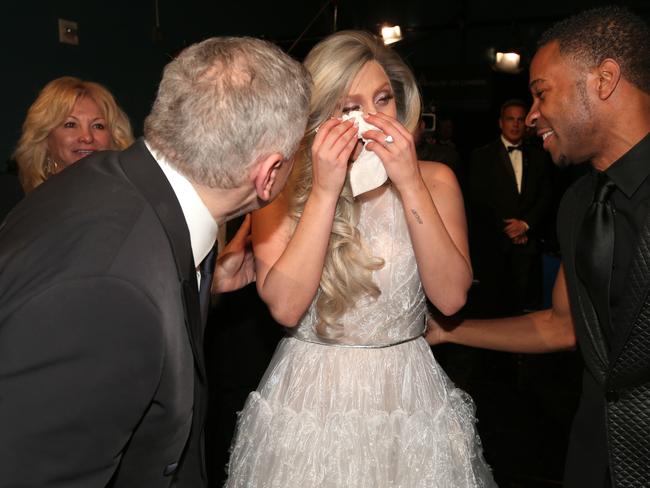 Lady Gaga dries her eyes at the 2015 Oscars.