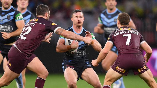 Damien Cook of the Blues is tackled by Matt Gillett (left) and Daly Cherry-Evans of the Maroons during Game 2 of the 2019 State of Origin series between the Queensland Maroons and the New South Wales Blues at Optus Stadium in Perth, Sunday, June 23, 2019. (AAP Image/Dan Himbrechts) NO ARCHIVING, EDITORIAL USE ONLY