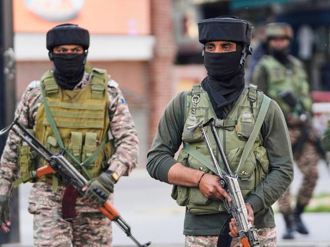 Indian soldiers guard at a market in Srinagar, Indian controlled Kashmir, Tuesday, May 6, 2025. (AP Photo/Mukhtar Khan)