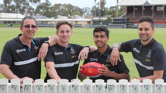 Former club champion Darren Mead with his son Jackson Mead, along with Trent Burgoyne and his dad, and former Power great, Peter Burgoyne. Picture: AAP Image/Russell Millard