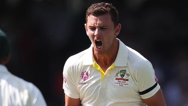 Australia's Josh Hazlewood celebrates the wicket of India's Virat Kohli caught behind during Day 1 of the 4th Test match between Australia and India at the SCG. Picture: Brett Costello