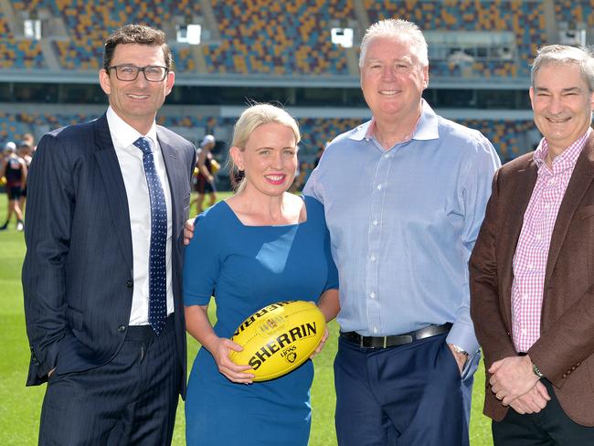 BRISBANE, AUSTRALIA - SEPTEMBER 13: Tourism Industry Development Minister Kate Jones, Brisbane Lions Chief Executive Officer Greg Swann and AFL General Manager of Clubs and Broadcasting Travis Auld (L) pose for a photo after making an announcement during a Brisbane Lions AFL media opportunity at The Gabba on September 13, 2019 in Brisbane, Australia. (Photo by Bradley Kanaris/Getty Images)