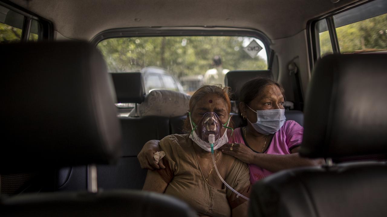 Patients infected with COVID-19 wearing oxygen masks in New Delhi. There are now fears that the country is running out of oxygen (Photo by Anindito Mukherjee/Getty Images)