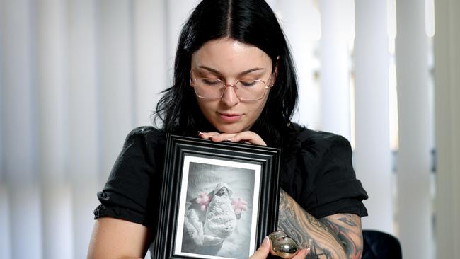 Haylee Loccisano, holding a photo and Urn of her unborn baby Celeste who was killed in a car crash at Ipswich and a 17-year-old girl charged, Springfield Lakes - on Friday 1st of November 2024 - Photo Steve Pohlner