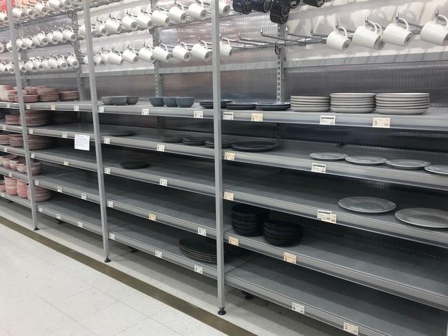 Plate shelves almost empty at Robina Town Centre Kmart Store on the Gold Coast