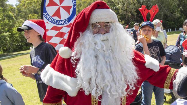 SYDNEY AUSTRALIA - NewsWire Photos, 16 DECEMBER, 2022: Premier Dominic Perrottet  greets Santa arriving at Bear Cottage children's hospice with gifts for children and families. Santa pictured with Kamahl Sadi.Picture: NCA NewsWire/ Simon Bullard.