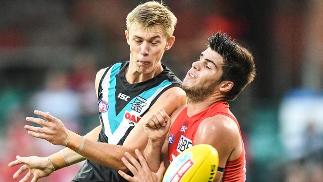 Young Port forward Todd Marshall feels the full force of Sydney’s Lewis Melican at the SCG on Sunday. Picture: AAP Image/Brendan Esposito