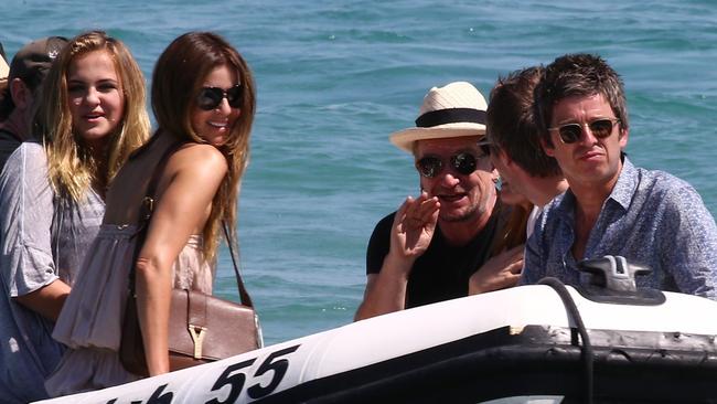 Noel Gallagher and Bono, with their wives Sara MacDonald and Ali Hewson, arrive at Le Club 55 in Saint Tropez, French Riviera. Picture by: Abaca / FameFlynet / SplashNews.com