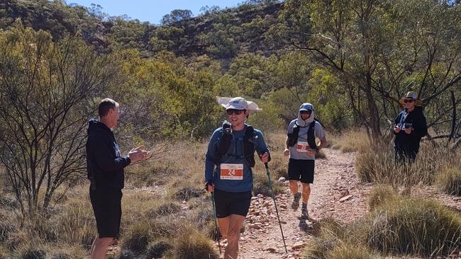 Shade Mcclymont, foreground, and Steven Bruce through Redbank Gorge after summiting Mt Sonder at the very beginning of the 231km Sonder Monster at the 2023 West Macs Monster. Picture: West Macs Monster.