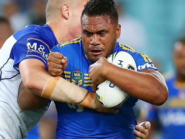 SYDNEY, AUSTRALIA - APRIL 29: Junior Paulo of the Eels is tackled during the round nine NRL match between the Parramatta Eels and the Canterbury Bulldogs at ANZ Stadium on April 29, 2016 in Sydney, Australia. (Photo by Mark Nolan/Getty Images)