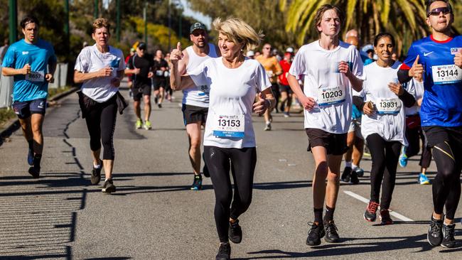 An avid runner, Ms Bishop gives fans the thumbs up during the fun run in Perth on Sunday. Picture: Supplied