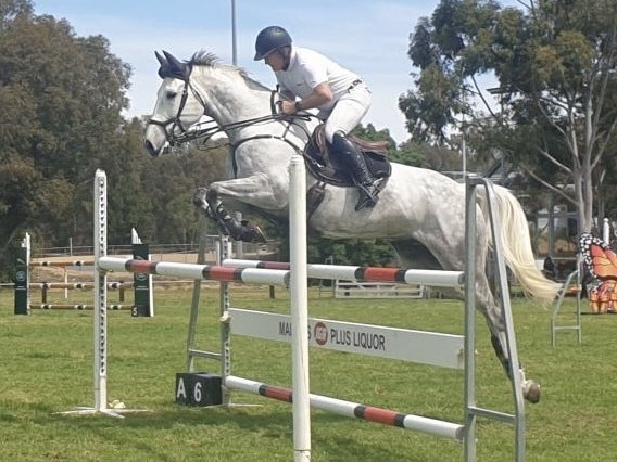 Up and away: Russell Hearn in action on RBH Dante at a previous Northern Victorian Showjumping Club event.