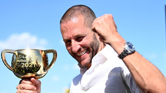 Brae Sokolski poses with the Lexus Melbourne Cup after Verry Elleegant’s victory. Picture: Getty Images