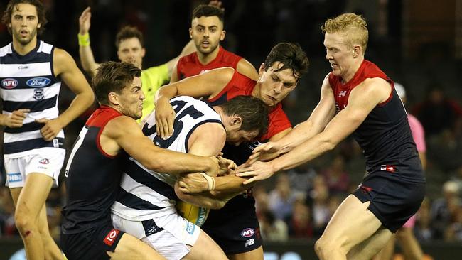 Melbourne’s Jack Viney Sam Weideman and Clayton Oliver tackle Geelong’s Patrick Dangerfield. Picture:Wayne Ludbey