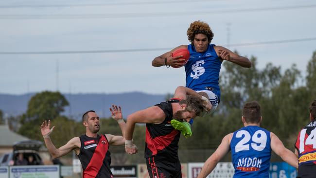 Scrutton braces with ball in tact. Picture: Ethan Nitz Photography