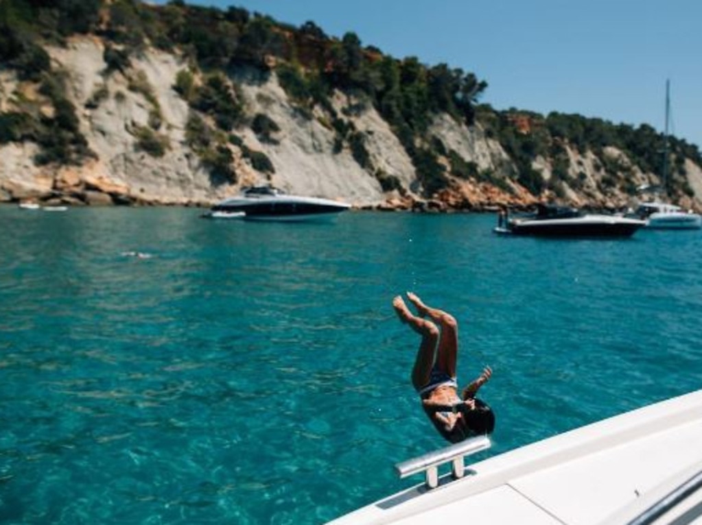 Ruby Rose somersaults into the turquoise waters of Ibiza. Picture: Ruby Rose/Instagram