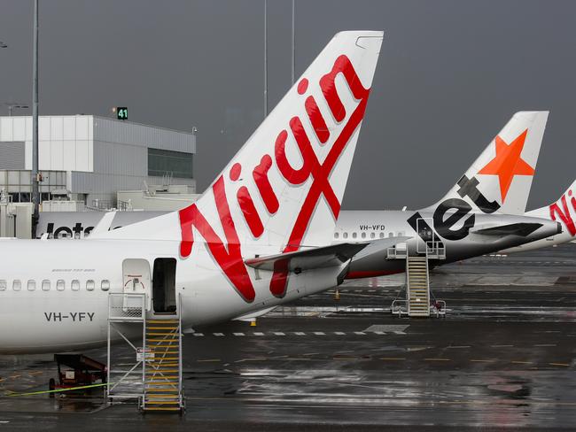 SYDNEY, AUSTRALIA - NewsWire Photos JUNE 28, 2021: Virgin and Jetstar Planes seen at Domestic Airport Terminal during the current Covid-19 Lockdown, Sydney Australia. Picture: NCA NewsWire / Gaye Gerard