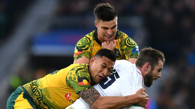 LONDON, ENGLAND - NOVEMBER 24:  Elliot Daly of England is tackled by Israel Folau and Jack Maddocks of Australia during the Quilter International match between England and Australia at Twickenham Stadium on November 24, 2018 in London, United Kingdom.  (Photo by Dan Mullan/Getty Images)