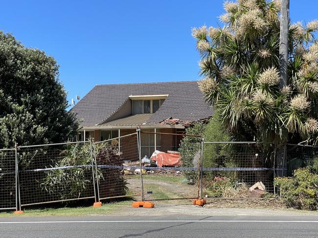 Jim and Carmel Madden’s Tower Hill home is fenced off the day after the couple were killed by a stray truck.