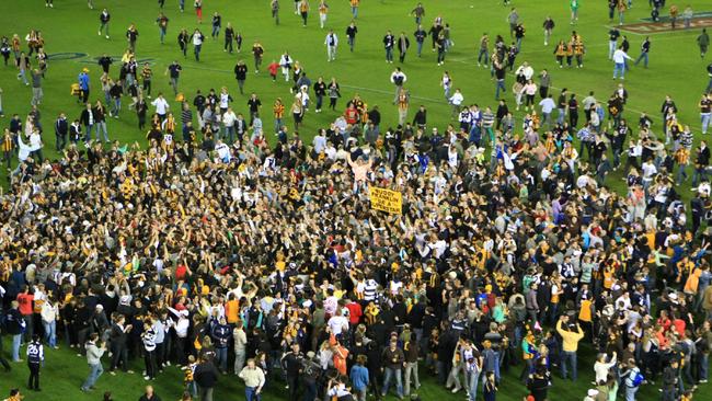 Fans invade the ground after Buddy’s 100th goal of the season.