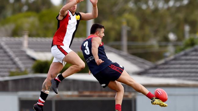 Steve Vocale gets a kick away against West Coburg in Round 1. Picture: Steve Tanner