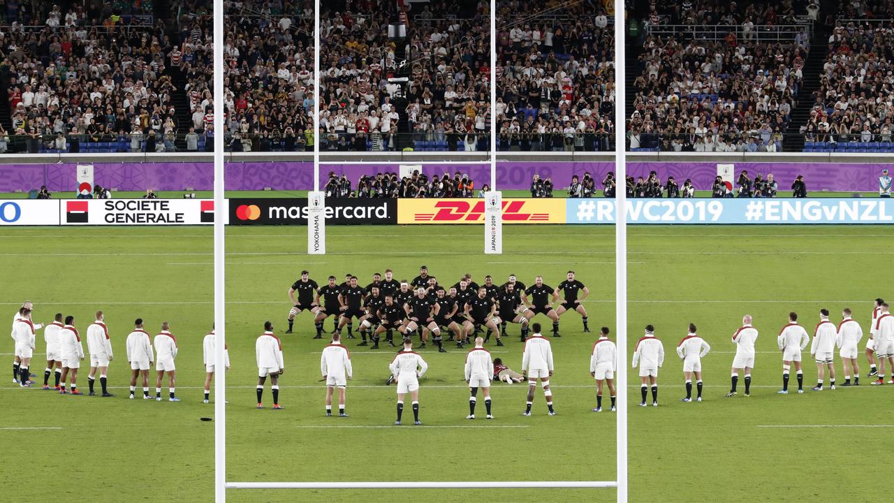 England players watch the All Blacks perform their haka during the Rugby World Cup semifinal at International Yokohama Stadium between New Zealand and England in Yokohama, Japan, Saturday, Oct. 26, 2019. (Kyodo News via AP)