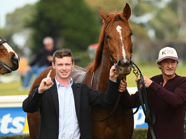 MELBOURNE, AUSTRALIA - JULY 17: Trainer Reece Goodwin and Barry Goodwin (r) after Lovelycut wo Race 1, the Sportsbet Photo Finish Refund Handicap - Betting Odds during Melbourne Racing at Sandown Lakeside Racecourse on July 17, 2024 in Melbourne, Australia. (Photo by Vince Caligiuri/Getty Images)