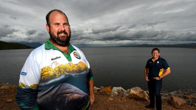 Rhyce Bullimore and Cr Mark Molachino at Ross River Dam in 2019, which was stocked with barra fingerlings. Picture: Evan Morgan