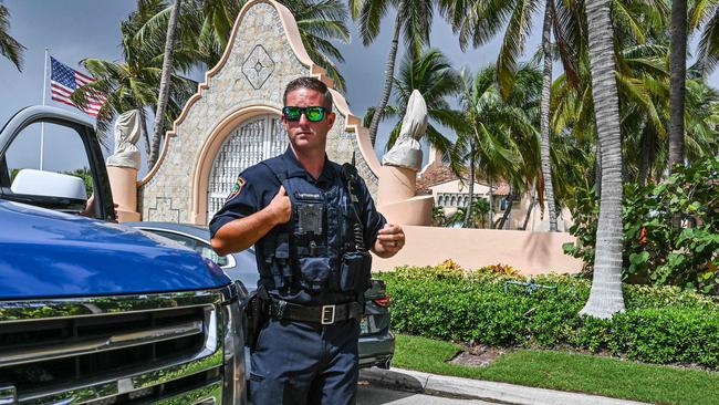 Local law enforcement officers are seen in front of the home of former President Donald Trump at Mar-a-Lago in Palm Beach, Florida on August 9.