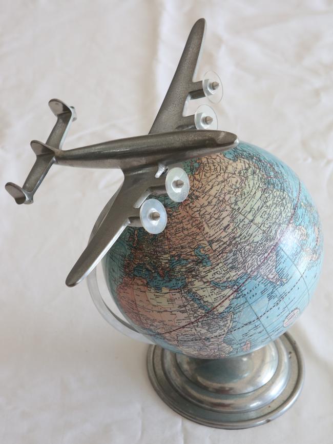 Globe and aircraft: This was from a friend who knew  about my formative years. Every house should have a globe to remind us we’re all spinning  in space. The aluminium plane is a Super Constellation. As a child I used to fly in them, before jets came on the scene.