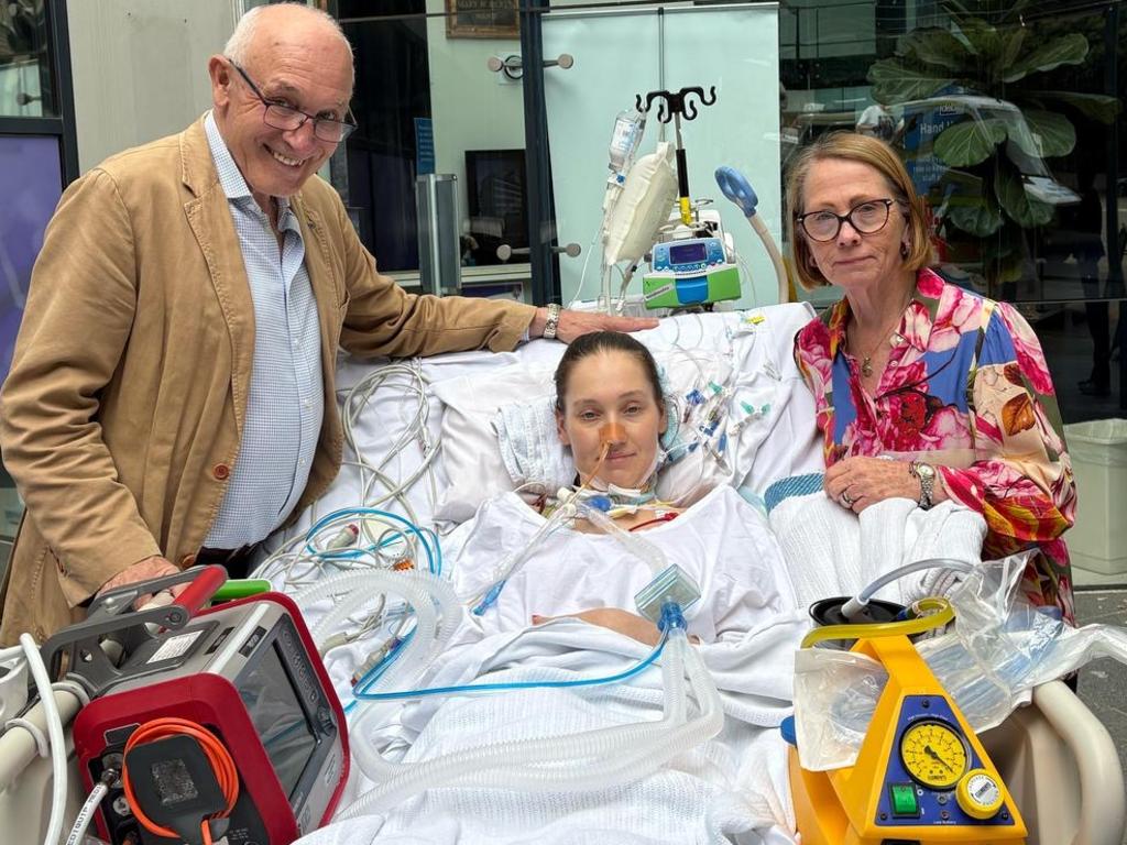 An emotional photograph of the Tudehopes after Lucy woke from her coma. Picture: Supplied