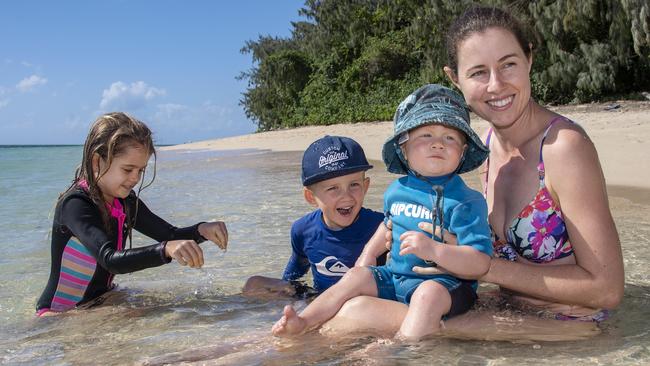 Melissa Pettett and her children Isabella, Max and Theo enjoy the warm waters of the Coral Sea at Green Island. Picture: Brian Cassey