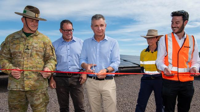 Assistant Defence Minister Matt Thistlethwaite (centre) with Member for Solomon Luke Gosling (centre left) cutting the ribbon at Robertson Barracks solar farm. Picture: Pema Tamang Pakhrin