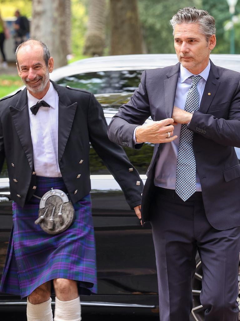 St Kilda FC President Andrew Bassat and actor Eric Bana arrive. Picture: Ian Currie