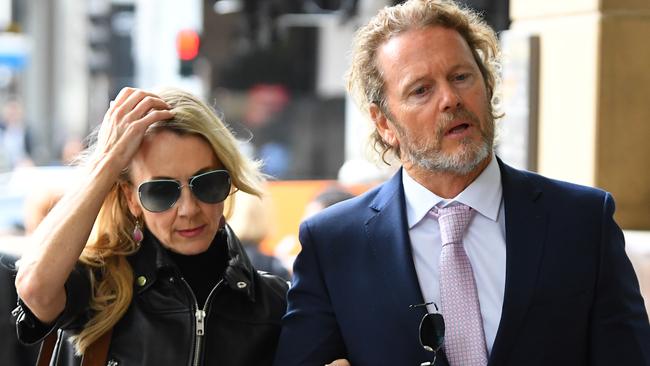 Australian actor Craig McLachlan and partner Vanessa Scammell, arrive at Melbourne Magistrates Court for an earlier hearing in December.