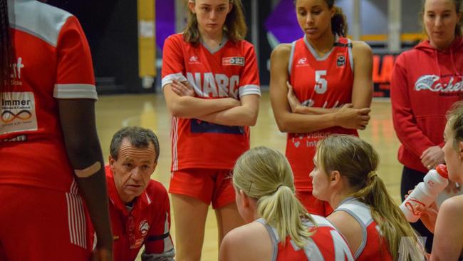 North Adelaide coach Brenton Johnston addresses his team last weekend. The Rockets wore black tape in memory of former coach Semmens. Picture: North Adelaide Rockets