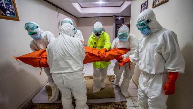 Covid-19 patients, such as this one on Wednesday in West Java’s Bogor, are dying at home because hospitals are full. Picture: AFP