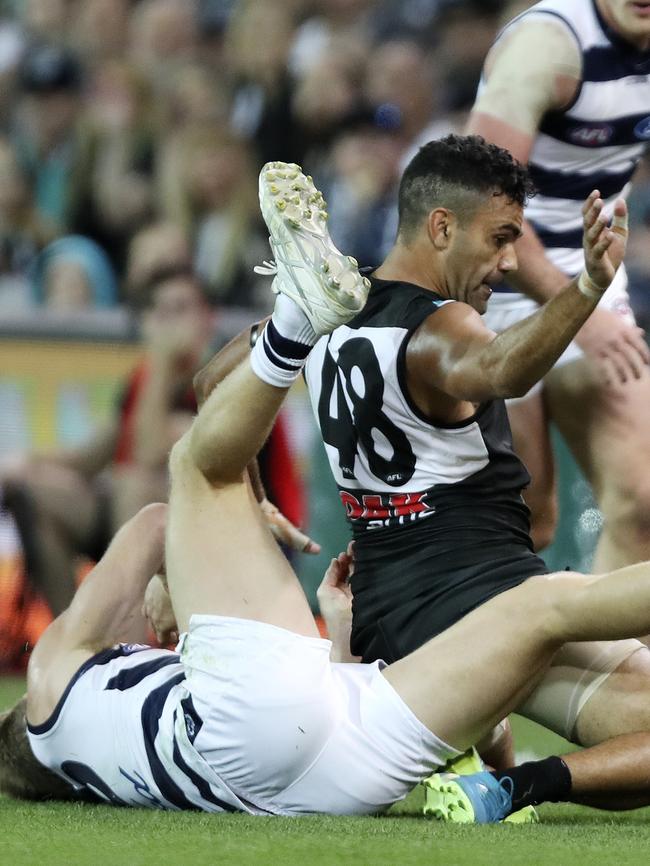 Lindsay Thomas went past the ball before bumping Selwood. Picture: Sarah Reed