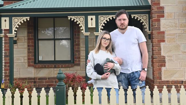 Erin Winchester and Michael Furtak, with their son Luca, who are renting at Mawson Lakes, have been waiting months for work to start on their first home at Angle Vale’s Lovegrove Estate. Picture: Keryn Stevens