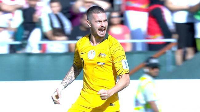 Jamie Maclaren celebrates scoring Australia's opener against Palestine