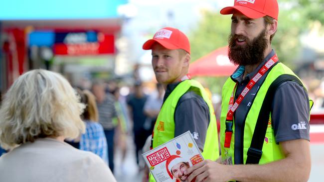 Port Adelaide star Justin Westhoff selling copies of The Big Issue magazine last year. Picture: Sam Wundke