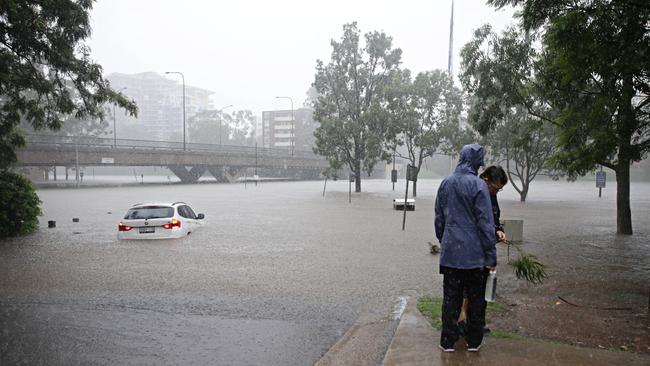 The car stuck in the Parramatta River on Sunday afternoon. Picture: Adam Yip