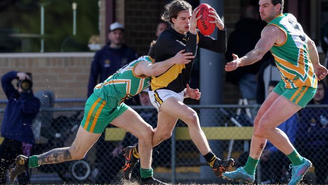 EFL: Braedon Dobie of Mooroolbark tackles Mitcham’s Jesse Cherry. Picture: George Salpigtidis