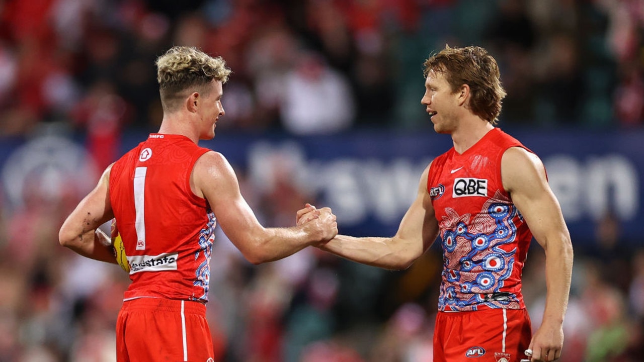 SYDNEY, AUSTRALIA - MAY 27: ChadÂ Warner of the Swans and CallumÂ Mills of the Swans celebrate winningd the round 11 AFL match between the Sydney Swans and the Richmond Tigers at Sydney Cricket Ground on May 27, 2022 in Sydney, Australia. (Photo by Cameron Spencer/AFL Photos/via Getty Images)