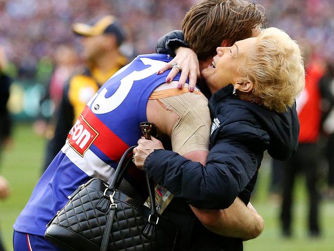 Bulldog Jordan Roughead embraces Susan Alberti after the siren. Picture: Mark Stewart