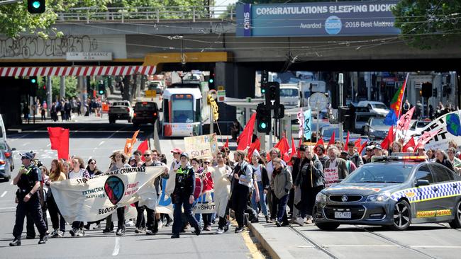 Protesters march against the International Mining &amp; Resources Conference. Picture: Andrew Henshaw